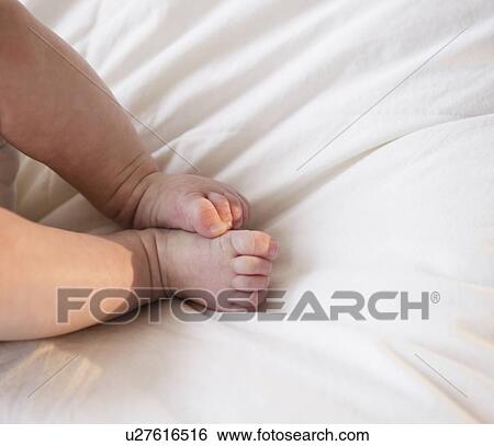 Stock Photograph - Feet of baby boy (2-5) . Fotosearch