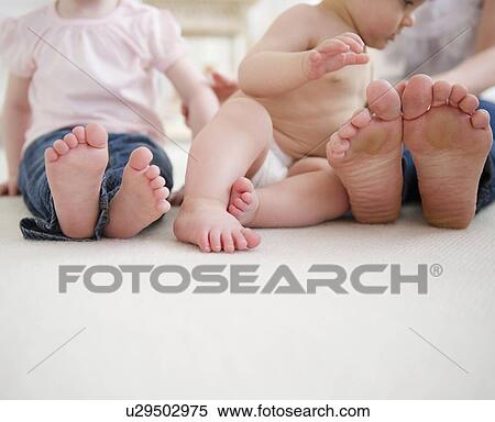 Feet of mother and children (6-11 months, 2-3) View Large Photo Image Stock Photography - Feet of mother and children (6-11 months, 2-3). Fotosearch