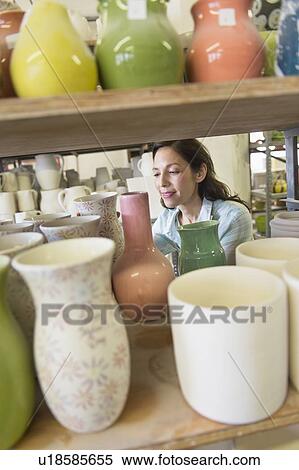 Female artist in pottery in studio View Large Photo Image Stock Photography - Female artist in pottery in studio. Fotosearch