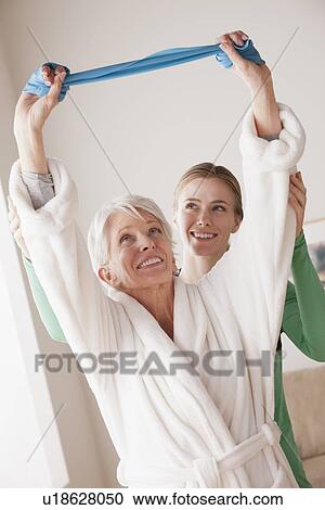 Female nurse with senior patient at home View Large Photo Image Stock Image - Female nurse with senior patient at home. Fotosearch