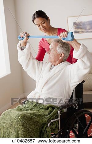 Female nurse with senior patient at home View Large Photo Image Stock Photo - Female nurse with senior patient at home. Fotosearch