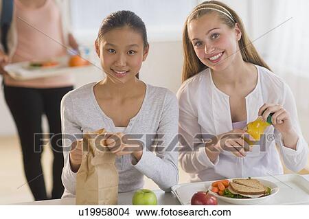 Female students (14-19) having lunch View Large Photo Image Picture - Female students (14-19) having lunch. Fotosearch