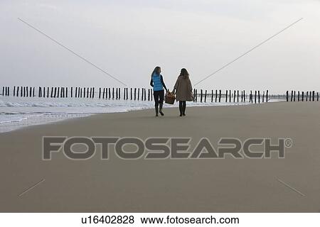 France, Pas-de-Calais, Escalles, Two women strolling on empty beach View Large Photo Image Stock Photo - France, Pas-de-Calais, Escalles, Two women strolling on empty beach. Fotosearch