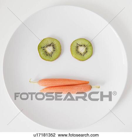 Fruit and vegetable face on plate, studio shot View Large Photo Image Stock Image - Fruit and vegetable face on plate, studio shot. Fotosearch