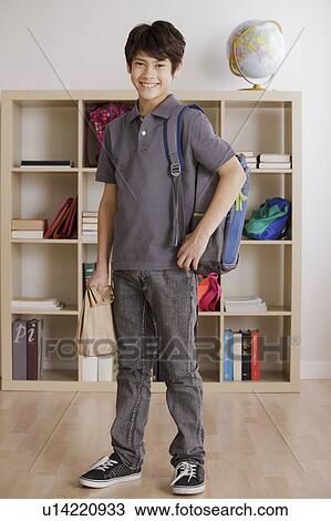 full length schoolboy (12-13) standing in classroom View Large Photo Image Stock Image - full length schoolboy (12-13) standing in classroom. Fotosearch
