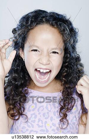 Girl (8-9) screaming, studio shot View Large Photo Image Stock Image - Girl (8-9) screaming, studio shot. Fotosearch