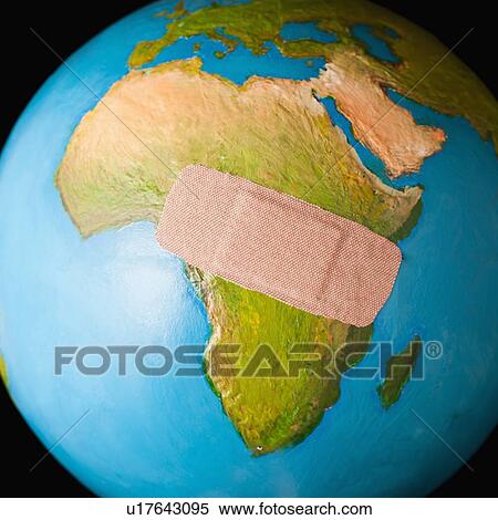 Stock Photography - Globe with band-aid . Fotosearch