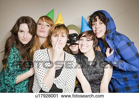 Group of friends wearing fancy dresses posing for portrait View Large Photo Image Stock Image - Group of friends wearing fancy dresses posing for portrait. Fotosearch