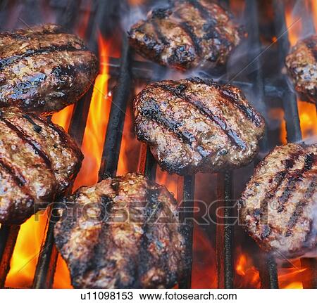 Stock Image - Hamburgers on bbq. Fotosearch
