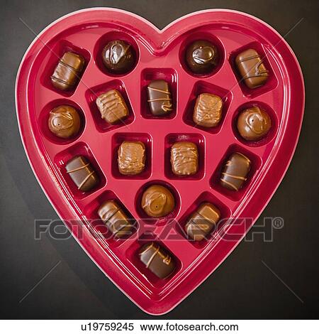 Stock Photography - Heart shaped box of chocolates. Fotosearch