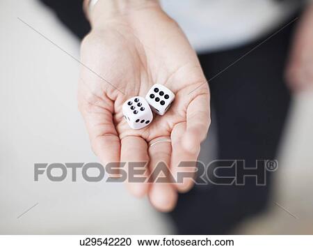 High angle view of hands with dices View Large Photo Image Stock Image - High angle view of hands with dices. Fotosearch