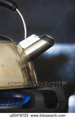 Kettle on stove View Large Photo Image Stock Image - Kettle on stove. Fotosearch