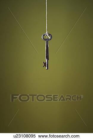 Stock Photography - Key hanging on string. Fotosearch