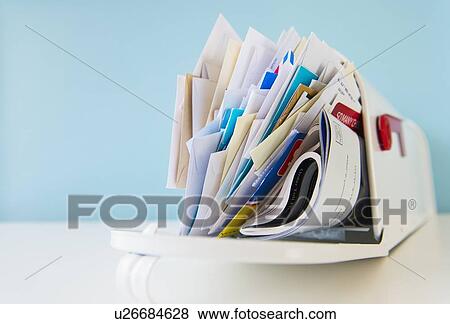 Stock Photo - Mailbox full of correspondence. Fotosearch
