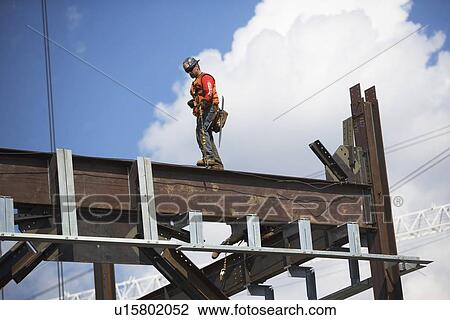 Stock Image - Male worker on construction site. Fotosearch