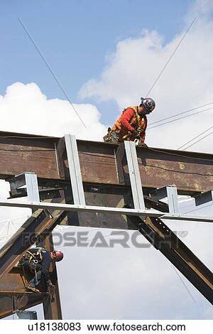 Stock Image - Male worker on construction site. Fotosearch