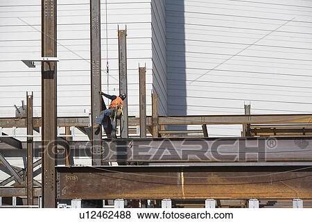 Male worker on construction site View Large Photo Image Stock Photo - Male worker on construction site. Fotosearch