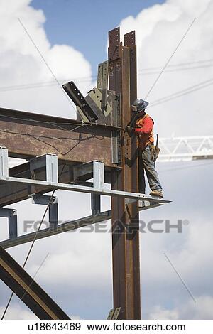 Stock Photo - Male worker on construction site. Fotosearch