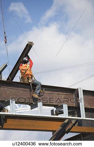 Male worker on construction site View Large Photo Image Stock Photograph - Male worker on construction site. Fotosearch