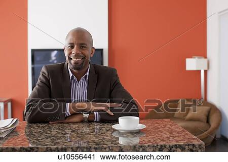 Man enjoying coffee at home View Large Photo Image Stock Image - Man enjoying coffee at home. Fotosearch