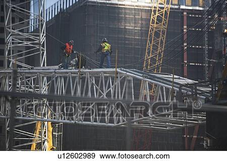 Manhattan, Workers on construction site View Large Photo Image Stock Photo - Manhattan, Workers on construction site. Fotosearch