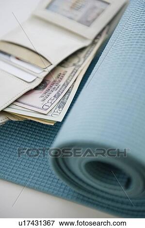 Money on yoga mat View Large Photo Image Stock Photo - Money on yoga mat. Fotosearch