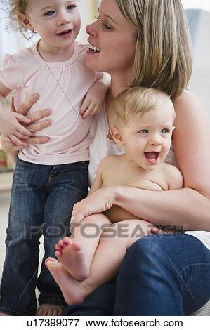 Mother and children (6-11 months, 2-3) View Large Photo Image Stock Photo - Mother and children (6-11 months, 2-3). Fotosearch