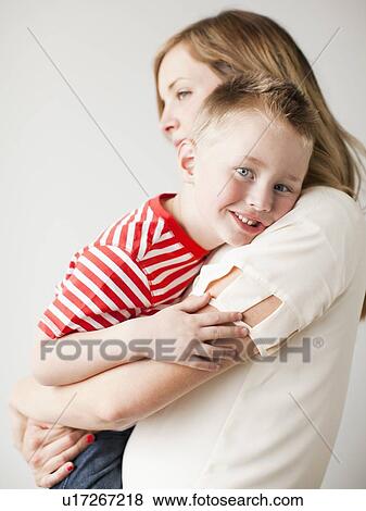 Mother and toddler boy (2-3) embracing View Large Photo Image Stock Photo - Mother and toddler boy (2-3) embracing. Fotosearch