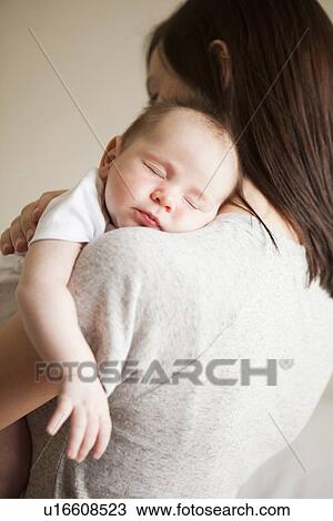 Mother embracing baby girl (2-5 months) View Large Photo Image Stock Image - Mother embracing baby girl (2-5 months). Fotosearch