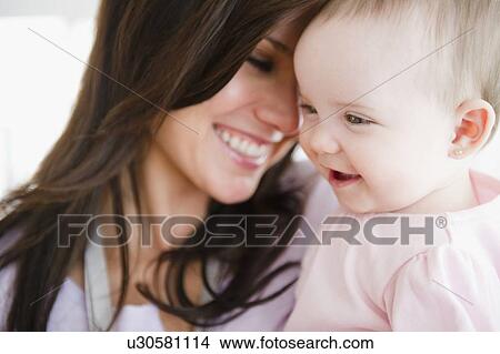 Mother with baby daughter (6-11 months) View Large Photo Image Picture - Mother with baby daughter (6-11 months) . Fotosearch