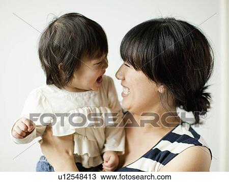 Mother with baby girl (12-17 months) View Large Photo Image Stock Image - Mother with baby girl (12-17 months). Fotosearch
