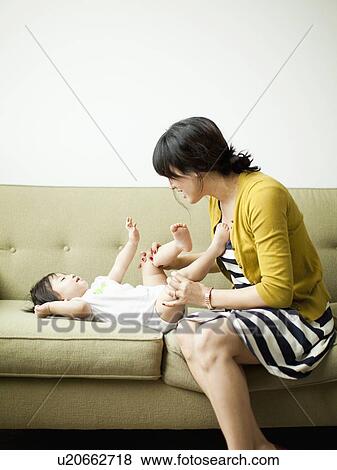 Stock Photo - Mother with baby girl (12-17 months). Fotosearch