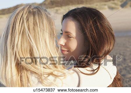 Mother with daughter on beach View Large Photo Image Stock Photo - Mother with daughter on beach. Fotosearch