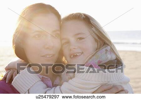 Mother with daughter on beach View Large Photo Image Stock Photo - Mother with daughter on beach. Fotosearch