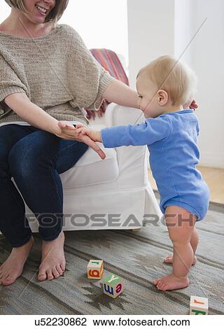 Mother with son (6-11 months) at home View Large Photo Image Stock Image - Mother with son (6-11 months) at home. Fotosearch