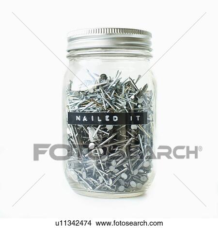 Picture - Nails in jar, studio shot. Fotosearch
