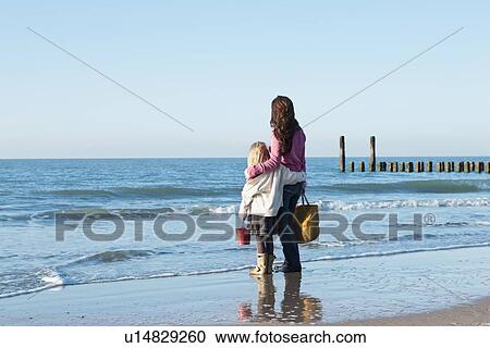 Netherlands, Zeeland, Haamstede, Mother with daughter on beach View Large Photo Image Stock Image - Netherlands, Zeeland, Haamstede, Mother with daughter on beach. Fotosearch