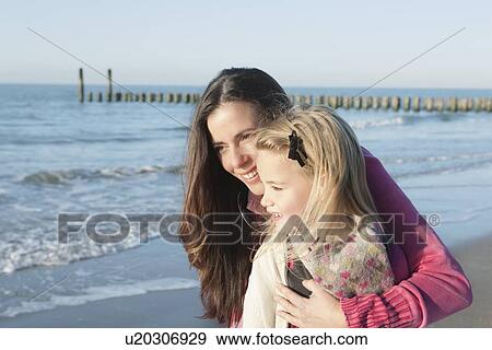Netherlands, Zeeland, Haamstede, Mother with daughter on beach View Large Photo Image Stock Photo - Netherlands, Zeeland, Haamstede, Mother with daughter on beach. Fotosearch