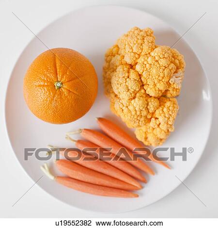 Orange fruits and vegetables on plate View Large Photo Image Stock Image - Orange fruits and vegetables on plate. Fotosearch
