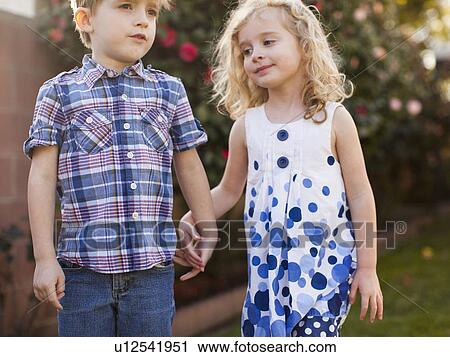 Outdoor portrait of girl (4-5) and boy (6-7) View Large Photo Image Stock Image - Outdoor portrait of girl (4-5) and boy (6-7) . Fotosearch
