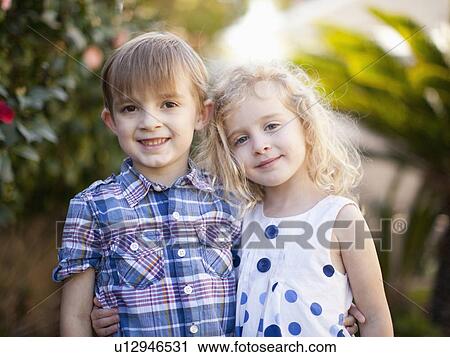 Outdoor portrait of girl (4-5) and boy (6-7) View Large Photo Image Stock Image - Outdoor portrait of girl (4-5) and boy (6-7) . Fotosearch
