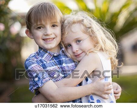Outdoor portrait of girl (4-5) and boy (6-7) View Large Photo Image Stock Image - Outdoor portrait of girl (4-5) and boy (6-7) . Fotosearch