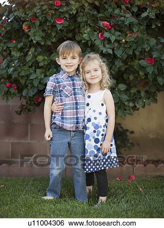 Outdoor portrait of girl (4-5) and boy (6-7) View Large Photo Image Stock Photograph - Outdoor portrait of girl (4-5) and boy (6-7) . Fotosearch