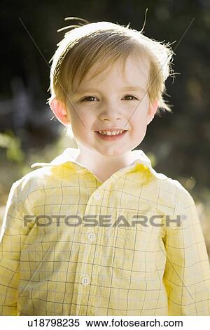 Outdoor portrait of happy young boy (6-7) View Large Photo Image Stock Photography - Outdoor portrait of happy young boy (6-7) . Fotosearch