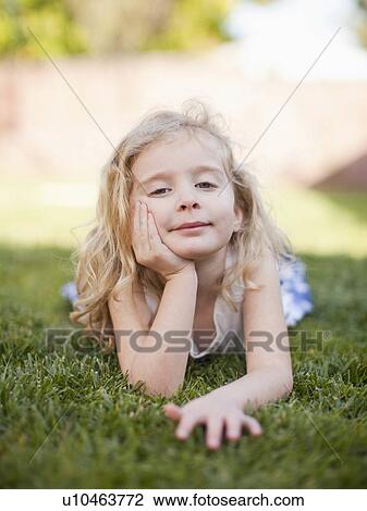 Stock Image - Outdoor portrait of happy young girl (4-5) . Fotosearch
