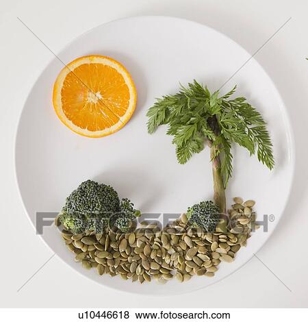 Palm tree on plate made out of food, studio shot View Large Photo Image Stock Photo - Palm tree on plate made out of food, studio shot. Fotosearch