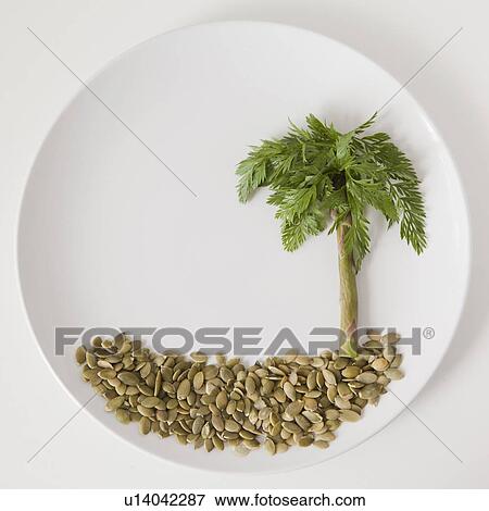 Stock Photo - Palm tree on plate made out of food, studio shot. Fotosearch