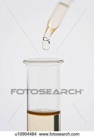 Pipetting liquid into test tube View Large Photo Image Picture - Pipetting liquid into test tube. Fotosearch
