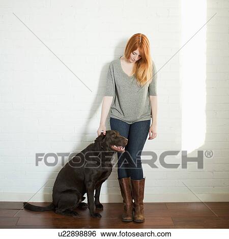 Portrait of attractive young woman and her dog View Large Photo Image Stock Photograph - Portrait of attractive young woman and her dog. Fotosearch