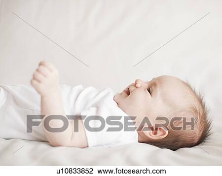 Stock Image - Portrait of baby boy (2-5 months) . Fotosearch